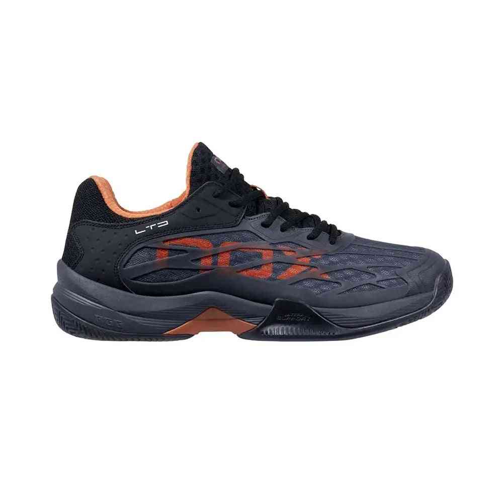 Nox AT10 Lux Limited Edition athletic shoe in black with orange accents, side profile showcasing sleek design and LTD branding.