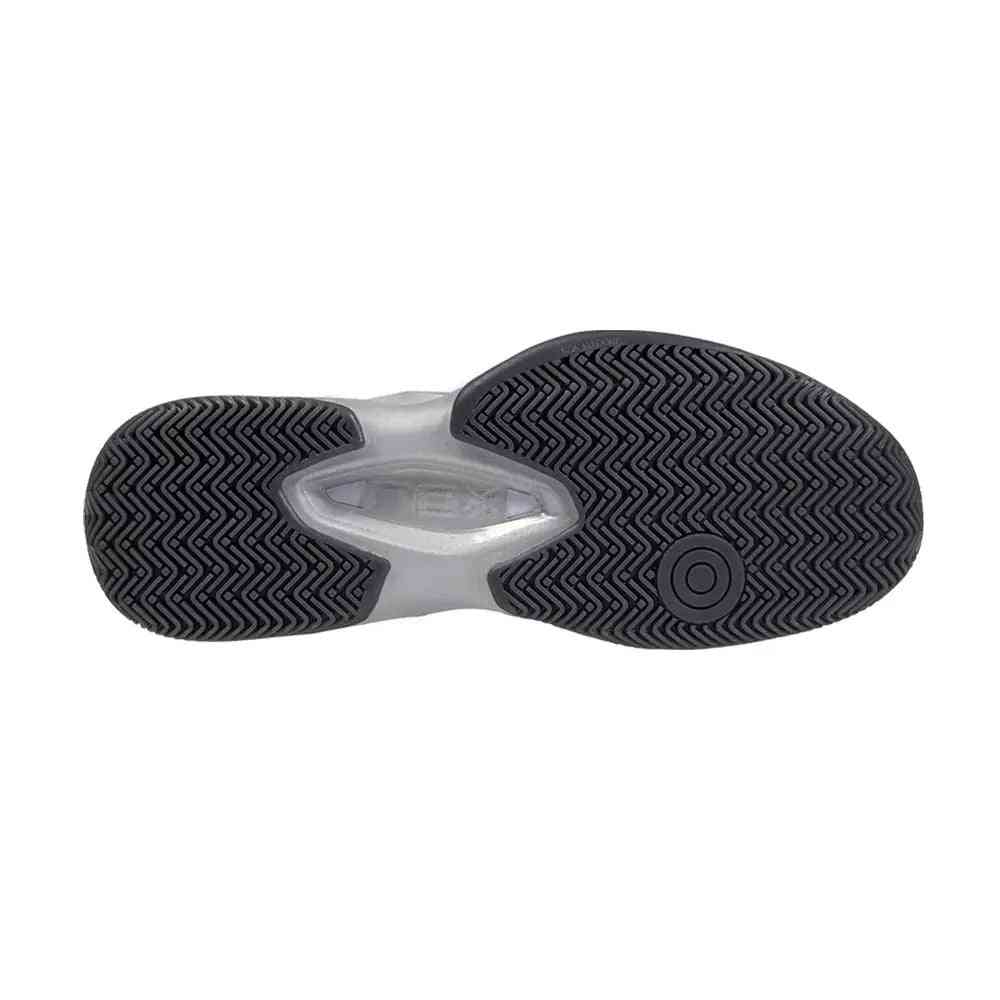 Outsole of Nox ML10 Hexa Calmlhexrurc maroon shoe featuring herringbone tread for superior grip on multiple court surfaces.