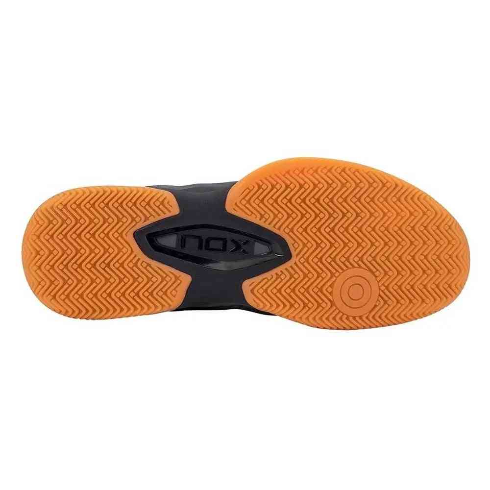 Outsole of Nox ML10 Hexa Calmlhexoran Grey padel shoe featuring herringbone tread pattern for enhanced traction and stability on court.