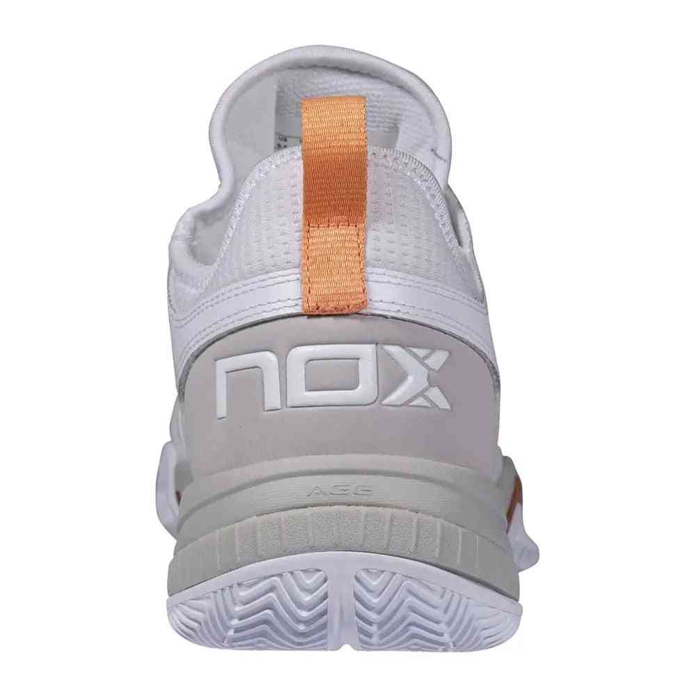 Rear view of Nox Lux Nerbo White Coral Caluxnerwhcor shoe featuring NOX branding and coral pull tab for easy wear and ankle support.