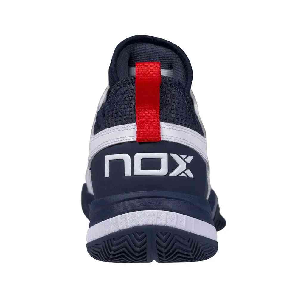 Rear view of Nox Lux Nerbo White Navy Blue Caluxnerwhna with red pull tab and bold NOX branding on heel for sporty style.