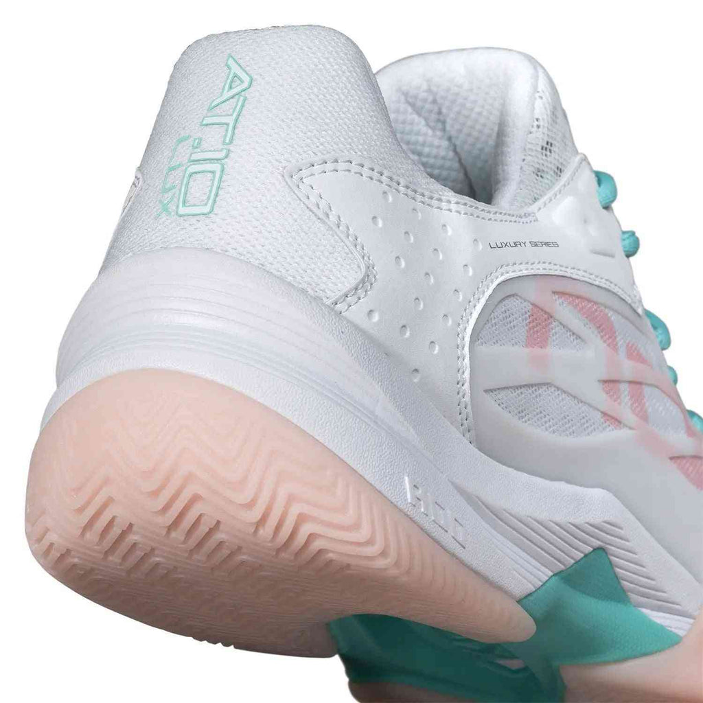 Close-up of Nox AT10 Lux Calatluxwhpo White Women's heel showing AT10 Lux branding, padded collar, and durable sole for stability and impact absorption.