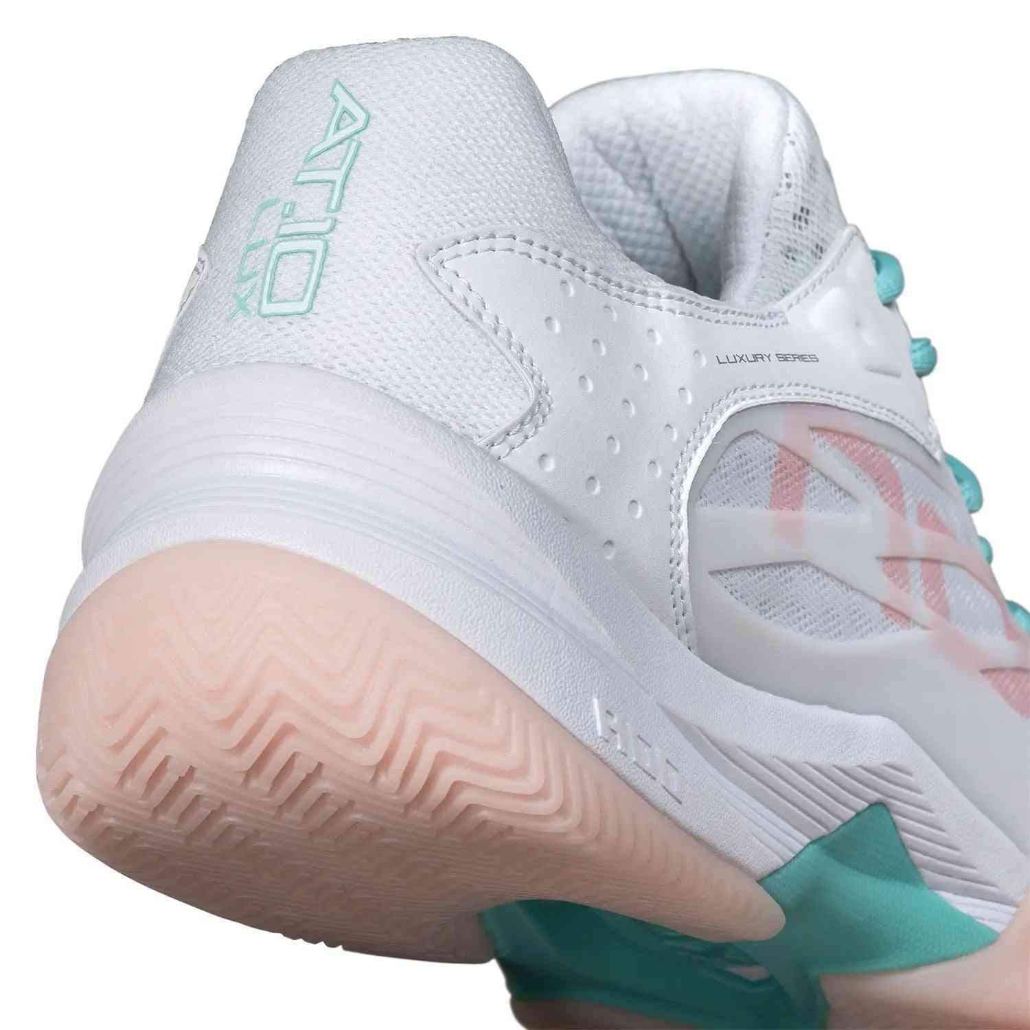 Close-up of Nox AT10 Lux Calatluxwhpo White Women's heel showing AT10 Lux branding, padded collar, and durable sole for stability and impact absorption.