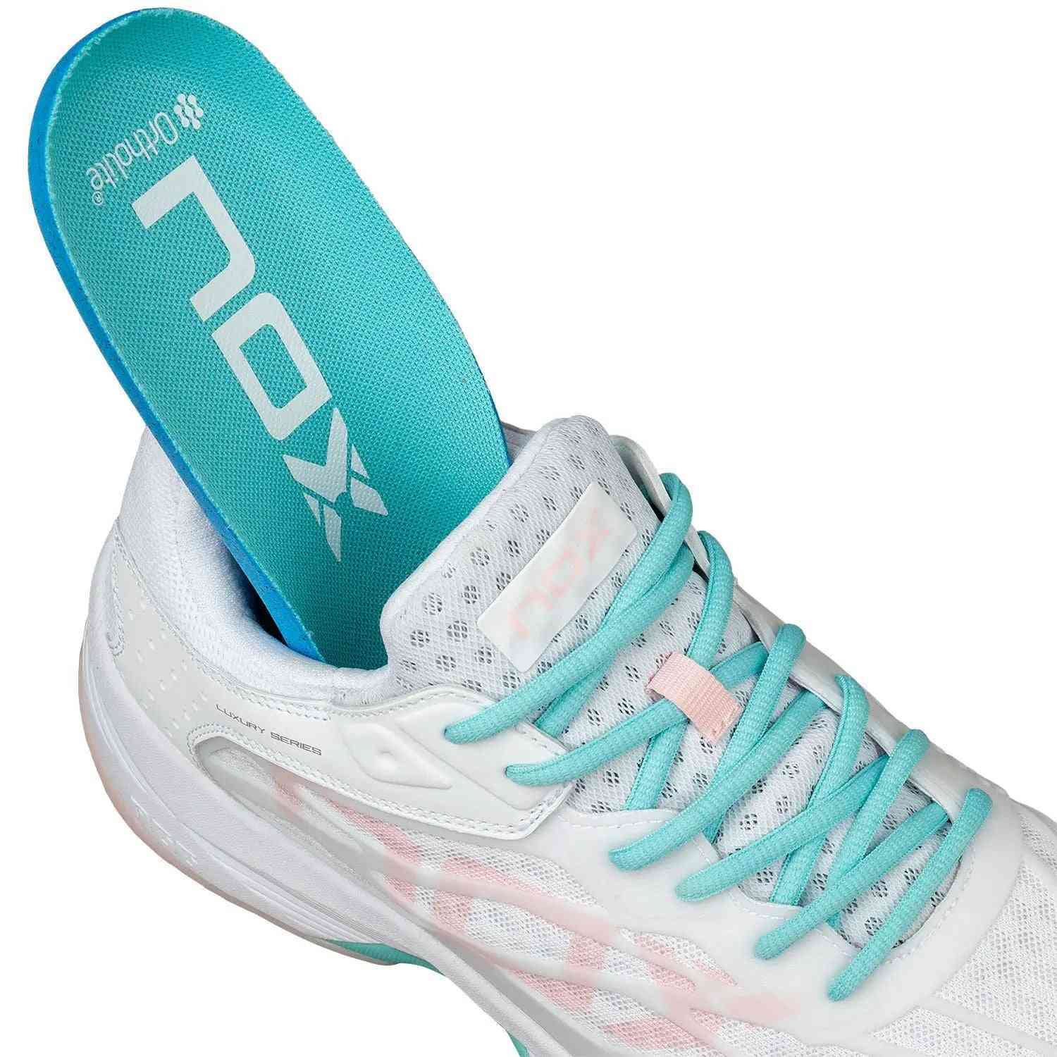 Nox AT10 Lux Calatluxwhpo White Women's shoe with removable turquoise Ortholite insole and breathable mesh upper for lightweight athletic performance.