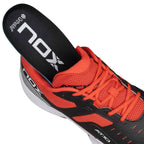 Nox AT10 Pro Calat10blre Black with removable Ortholite insole, showcasing breathable red mesh and cushioned interior for padel performance.